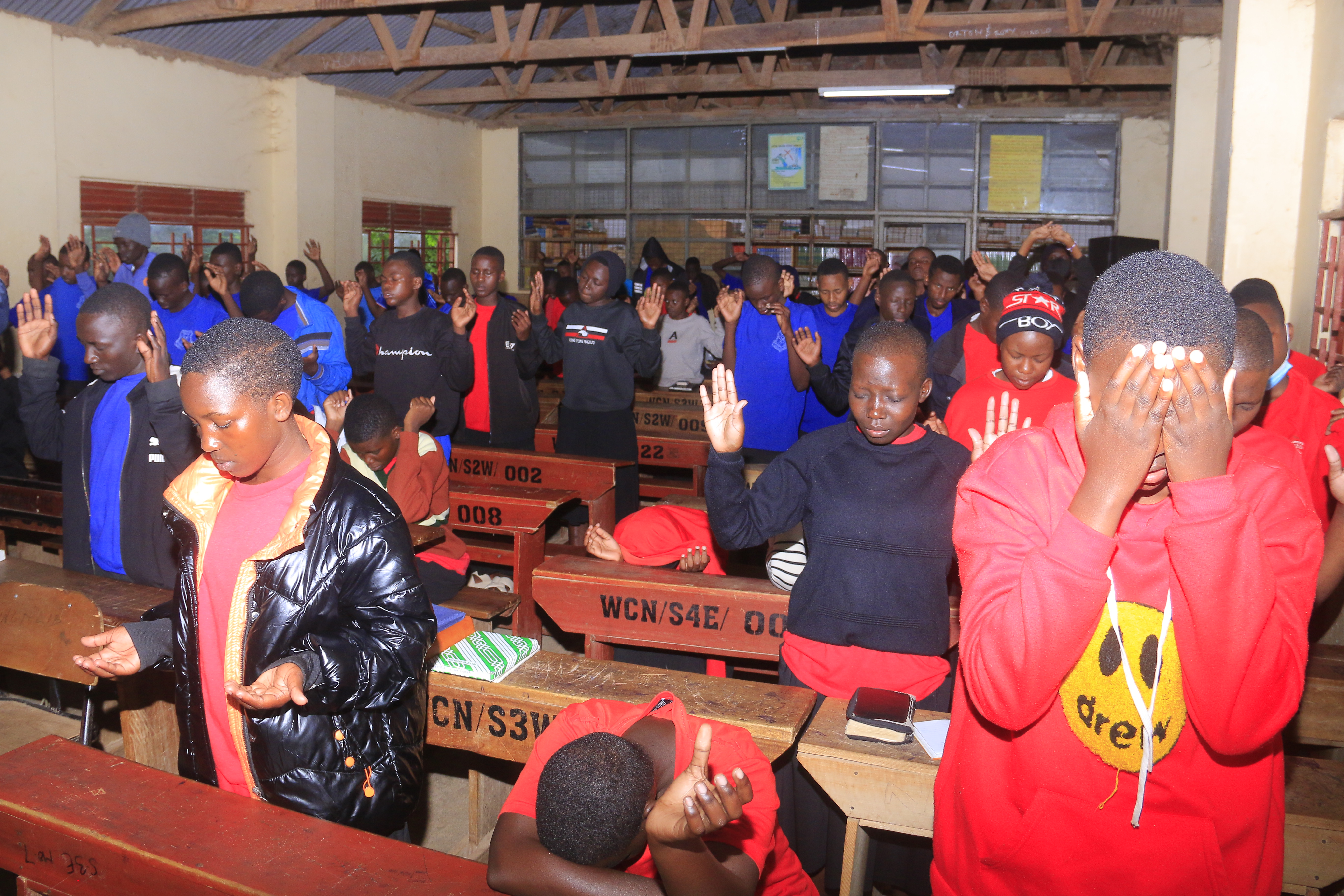 Students worshiping during a school ministry outreach event by Believers' Network International.